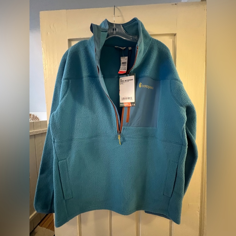 Cotopaxi Light Blue “lake” Fleece Jacket with Orange Accents